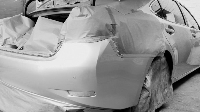 Lexus plastic bumper masked and prepped for painting